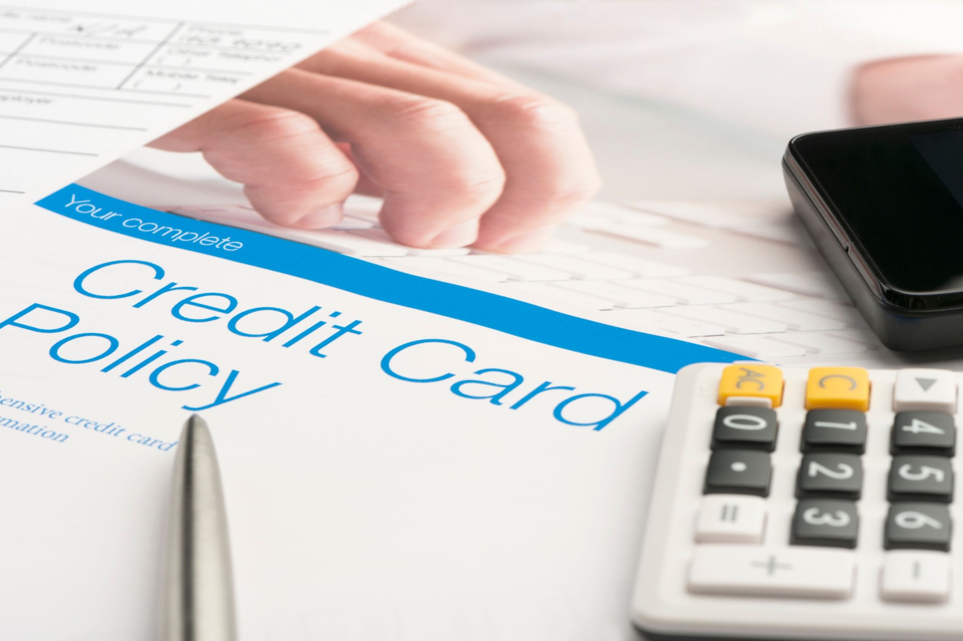 Credit card policy document with paperwork